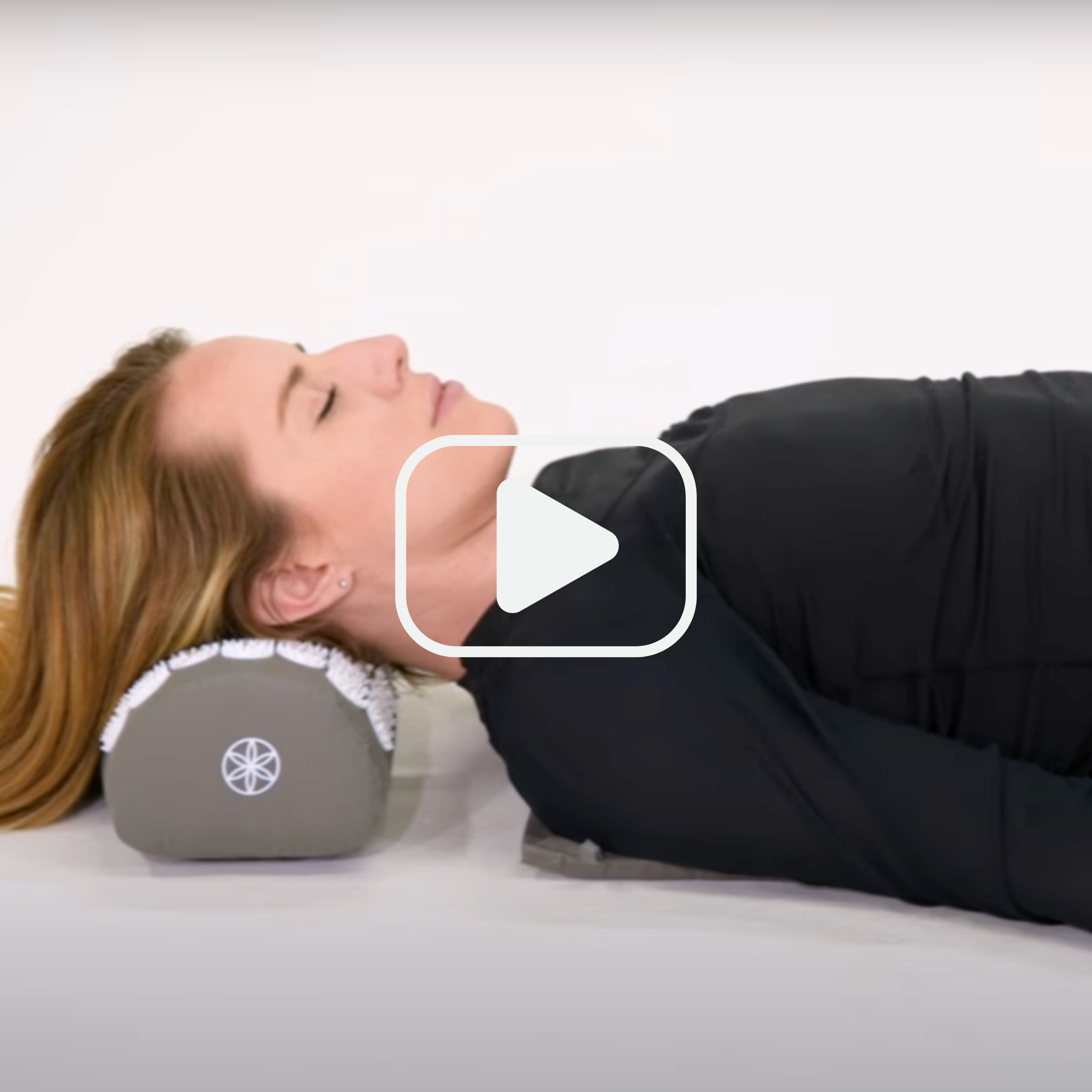 Woman laying on Acupressure Mat & pillow